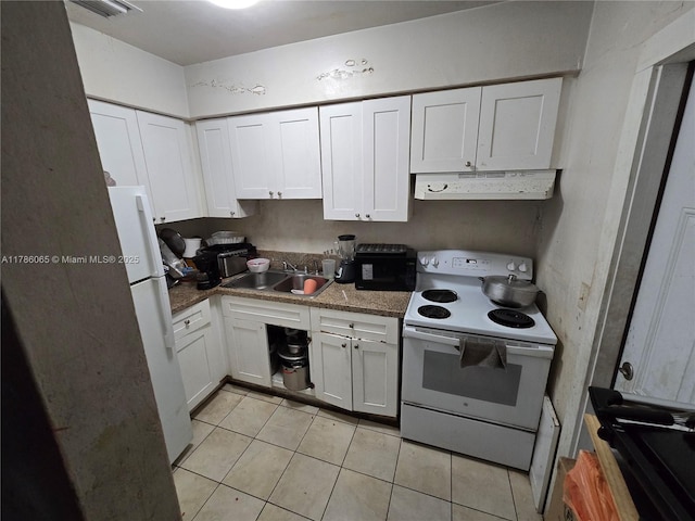 kitchen with white appliances, under cabinet range hood, a sink, white cabinetry, and light tile patterned flooring