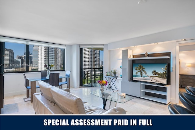 540 Brickell Key Dr Unit 1411, Miami, FL 33131 - living room featuring a city view and baseboards