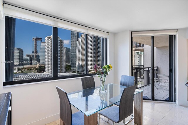 540 Brickell Key Dr Unit 1411, Miami, FL 33131 - dining space with baseboards and a view of skyline