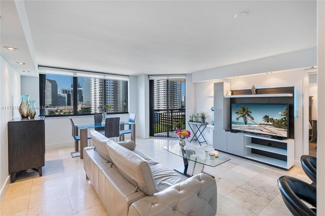 540 Brickell Key Dr Unit 1411, Miami, FL 33131 - living room featuring baseboards, light tile patterned floors, and recessed lighting