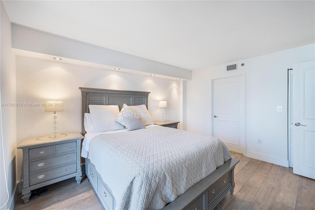 540 Brickell Key Dr Unit 1411, Miami, FL 33131 - bedroom with light wood finished floors and baseboards