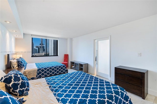 540 Brickell Key Dr Unit 1411, Miami, FL 33131 - bedroom featuring baseboards and light tile patterned floors