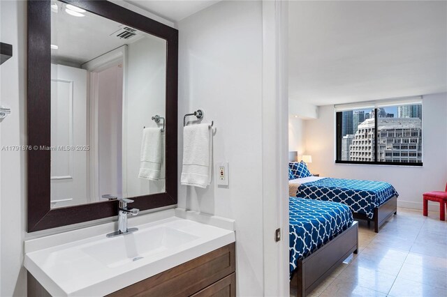 540 Brickell Key Dr Unit 1411, Miami, FL 33131 - bathroom featuring tile patterned floors, baseboards, and vanity