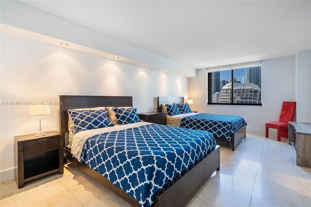 540 Brickell Key Dr Unit 1411, Miami, FL 33131 - bedroom featuring baseboards and tile patterned flooring