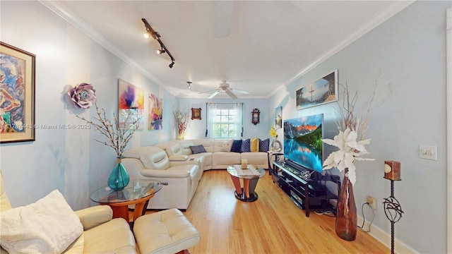 living area featuring crown molding, a ceiling fan, rail lighting, and wood finished floors