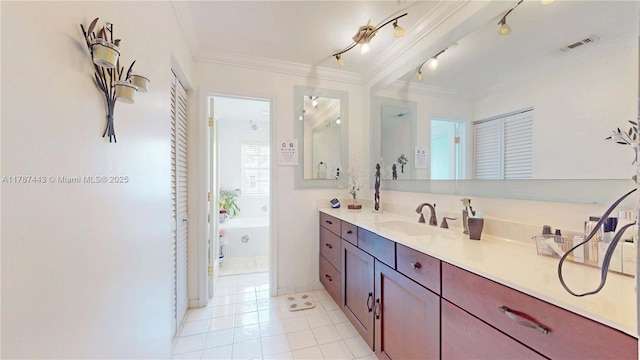 bathroom with visible vents, ornamental molding, tile patterned flooring, vanity, and a bathing tub