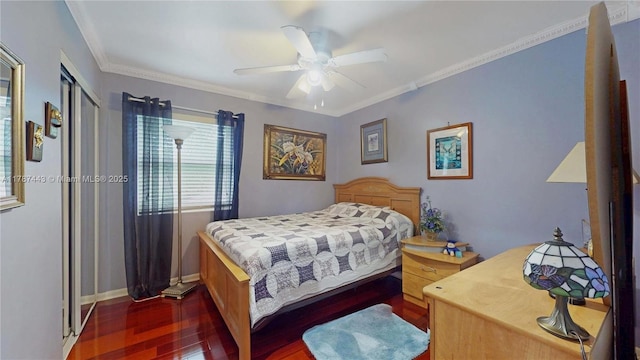 bedroom with crown molding, baseboards, ceiling fan, and wood finished floors