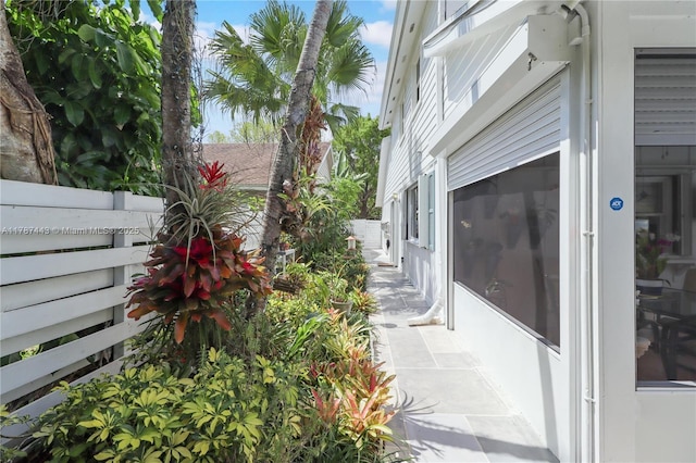 view of side of home with fence