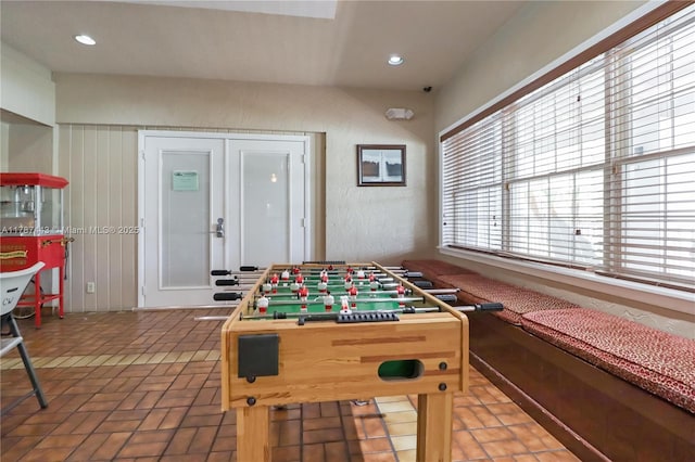 game room with brick floor