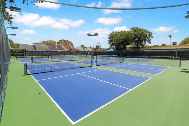 view of sport court featuring community basketball court and fence