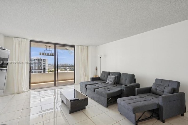 2500 Parkview Dr Unit 1816, Hallandale Beach, FL 33009 - living room with light tile patterned floors and a textured ceiling