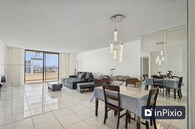 2500 Parkview Dr Unit 1816, Hallandale Beach, FL 33009 - dining space with light tile patterned floors, a textured ceiling, and floor to ceiling windows