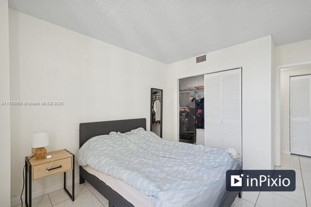 2500 Parkview Dr Unit 1816, Hallandale Beach, FL 33009 - tiled bedroom with baseboards, visible vents, and a closet