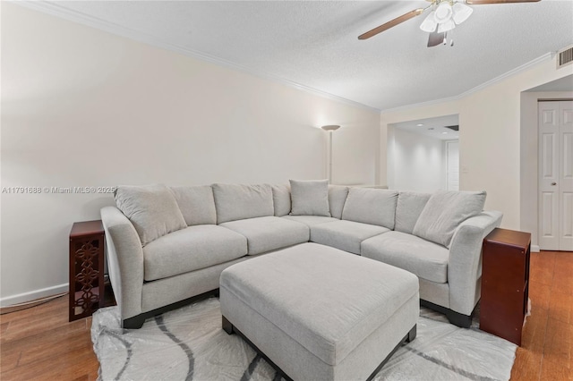 300 SW 130th Ter Unit 203B, Pembroke Pines, FL 33027 - living area with ceiling fan, crown molding, light wood-style floors, and baseboards