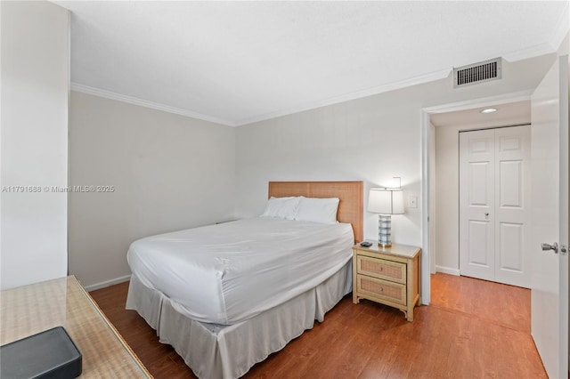 300 SW 130th Ter Unit 203B, Pembroke Pines, FL 33027 - bedroom featuring crown molding, wood finished floors, and baseboards