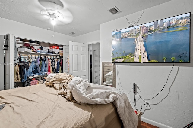 bedroom featuring visible vents and a closet