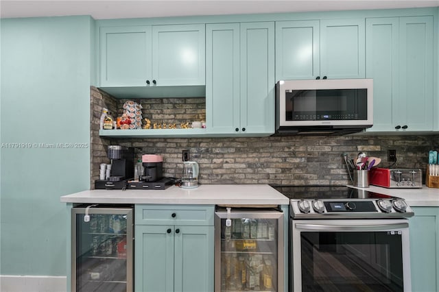 3030 SW 77th Ct, Miami, FL 33155 - bar featuring wine cooler, white microwave, electric range, and tasteful backsplash