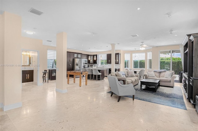 943 Golden Cane Dr, Weston, FL 33327 - living room featuring ornate columns, visible vents, ceiling fan, and plenty of natural light