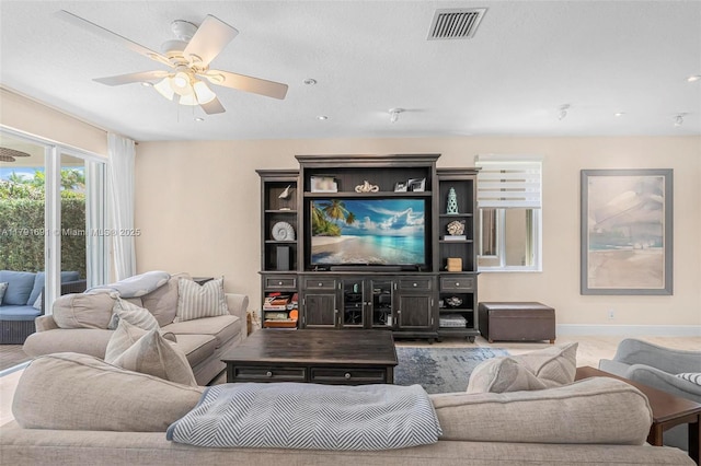943 Golden Cane Dr, Weston, FL 33327 - living area with visible vents, ceiling fan, and baseboards