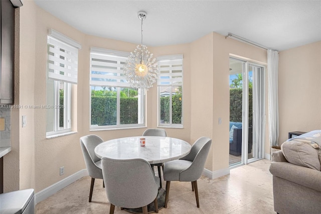 943 Golden Cane Dr, Weston, FL 33327 - dining space with a chandelier and baseboards