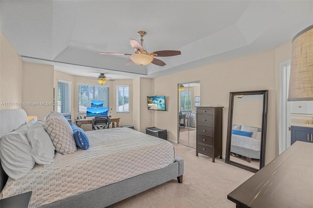 943 Golden Cane Dr, Weston, FL 33327 - bedroom with a raised ceiling, ceiling fan, and light colored carpet
