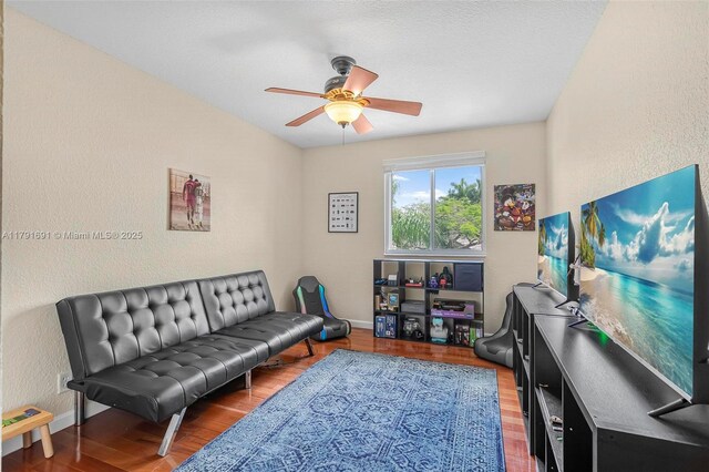 943 Golden Cane Dr, Weston, FL 33327 - living area featuring a ceiling fan, a textured wall, wood finished floors, and baseboards
