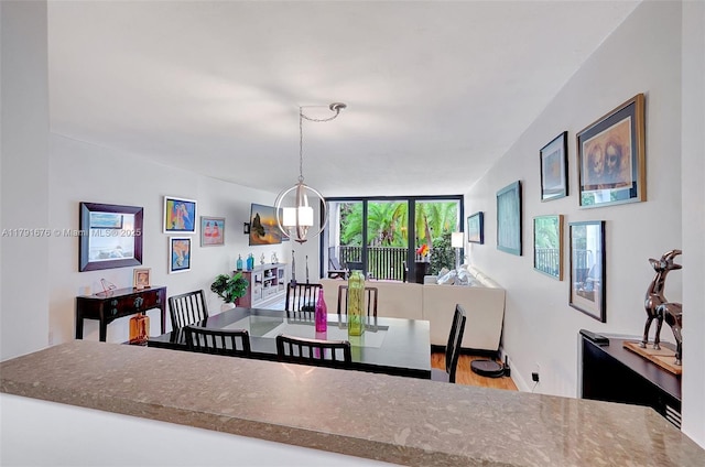 100 Ocean Lane Dr Unit 301, Key Biscayne, FL 33149 - dining room featuring wood finished floors and baseboards