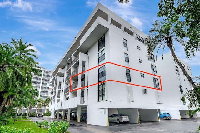 100 Ocean Lane Dr Unit 301, Key Biscayne, FL 33149 - view of building exterior featuring covered parking