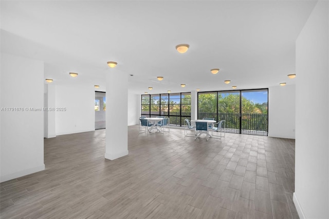 100 Ocean Lane Dr Unit 301, Key Biscayne, FL 33149 - unfurnished living room featuring floor to ceiling windows, wood finished floors, and plenty of natural light