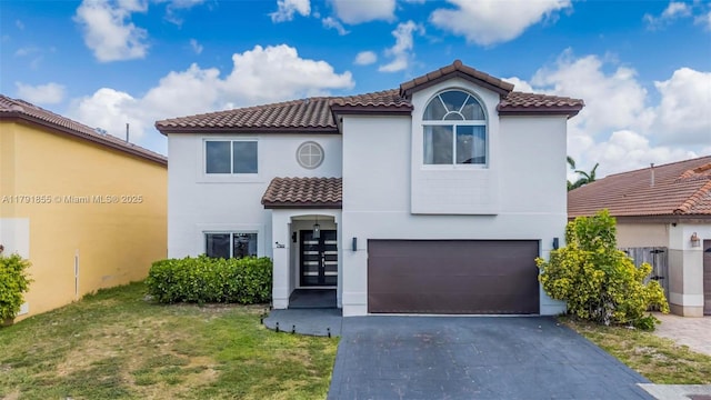 8323 NW 196th Ter, Hialeah, FL 33015 - mediterranean / spanish home with aphalt driveway, a tiled roof, stucco siding, a front lawn, and a garage