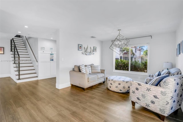 8323 NW 196th Ter, Hialeah, FL 33015 - living area with stairway, wood finished floors, recessed lighting, and a notable chandelier