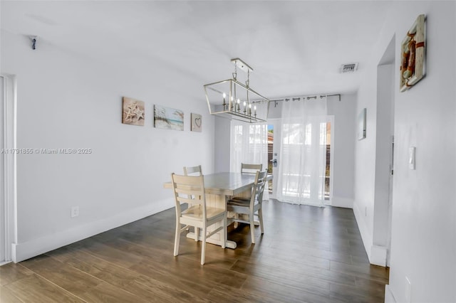8323 NW 196th Ter, Hialeah, FL 33015 - dining area featuring an inviting chandelier, visible vents, baseboards, and dark wood finished floors