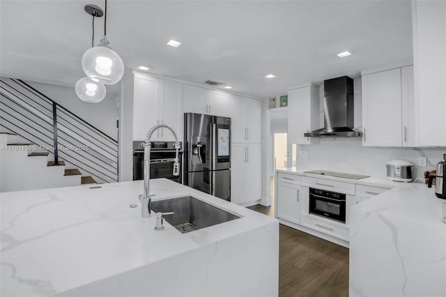 8323 NW 196th Ter, Hialeah, FL 33015 - kitchen featuring dark wood-type flooring, black appliances, visible vents, decorative light fixtures, and wall chimney range hood