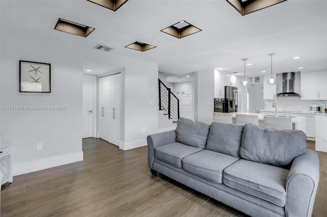 8323 NW 196th Ter, Hialeah, FL 33015 - living area with recessed lighting, wood finished floors, stairway, baseboards, and visible vents