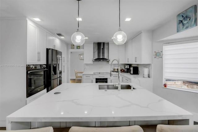 8323 NW 196th Ter, Hialeah, FL 33015 - kitchen with white cabinetry, stovetop, oven, wall chimney exhaust hood, and refrigerator with ice dispenser
