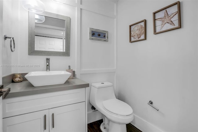 8323 NW 196th Ter, Hialeah, FL 33015 - bathroom with wood finished floors, toilet, and vanity