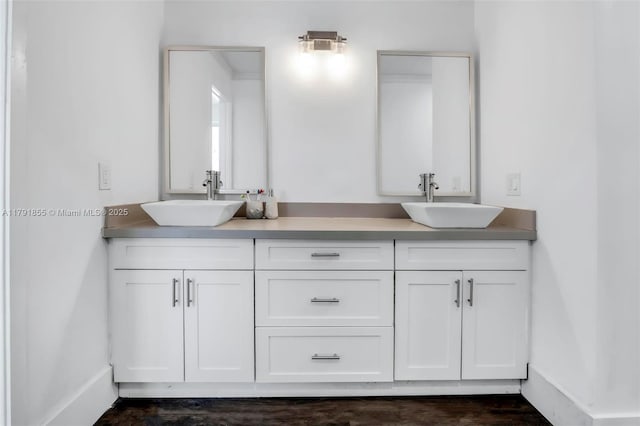 8323 NW 196th Ter, Hialeah, FL 33015 - bathroom featuring double vanity, a sink, and baseboards