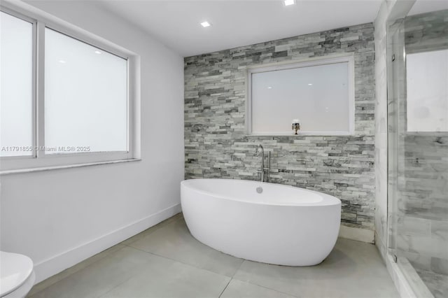 8323 NW 196th Ter, Hialeah, FL 33015 - bathroom featuring tile patterned floors, a freestanding tub, toilet, baseboards, and a stall shower