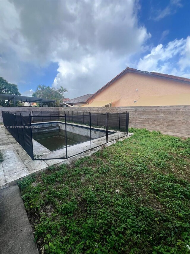 8323 NW 196th Ter, Hialeah, FL 33015 - view of pool with a fenced backyard