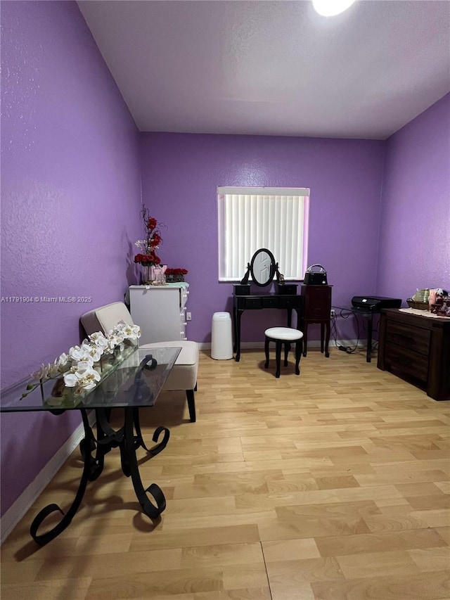 sitting room with light wood-style flooring