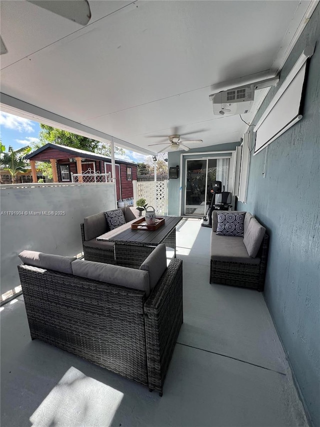 view of patio with outdoor lounge area and a ceiling fan