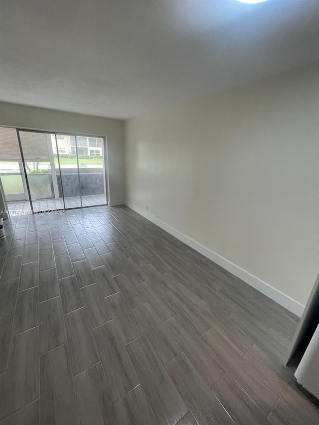 9851 Sandalfoot Blvd Unit 208, Boca Raton, FL 33428 - spare room with wood tiled floors and baseboards