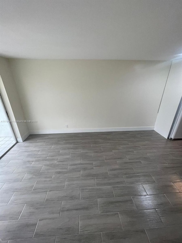 9851 Sandalfoot Blvd Unit 208, Boca Raton, FL 33428 - empty room with wood tiled floors and baseboards