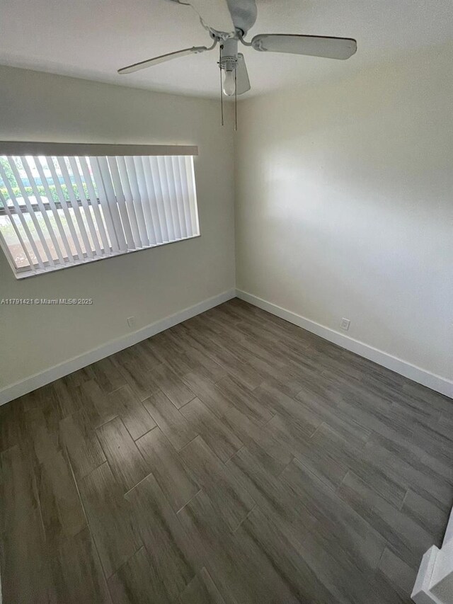 9851 Sandalfoot Blvd Unit 208, Boca Raton, FL 33428 - spare room featuring ceiling fan, dark wood-style floors, and baseboards