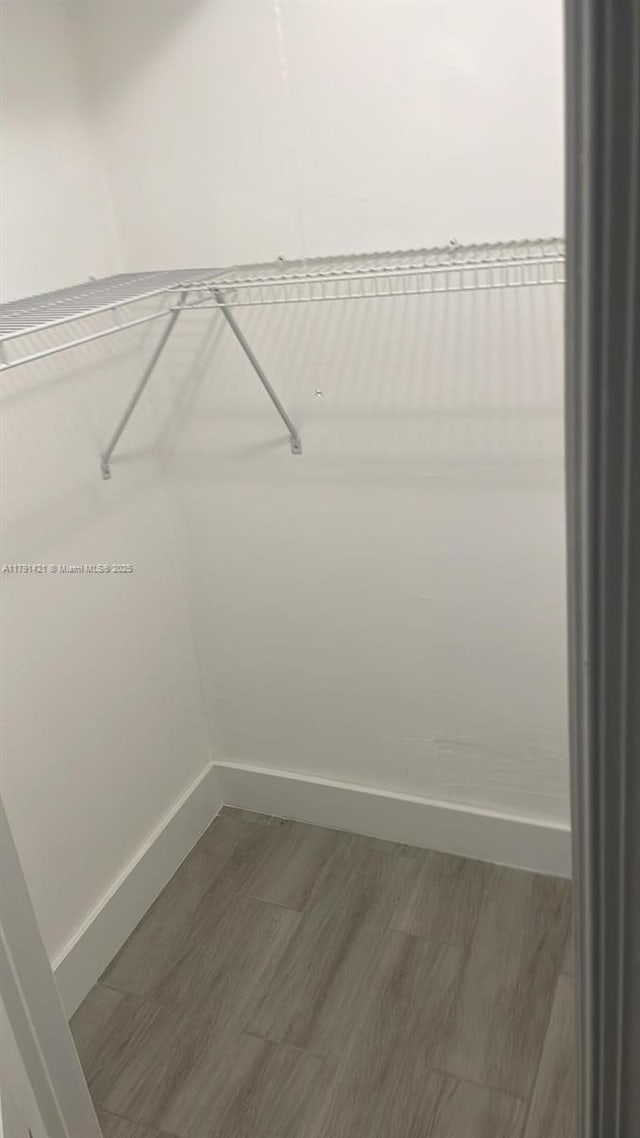 9851 Sandalfoot Blvd Unit 208, Boca Raton, FL 33428 - spacious closet with wood finished floors