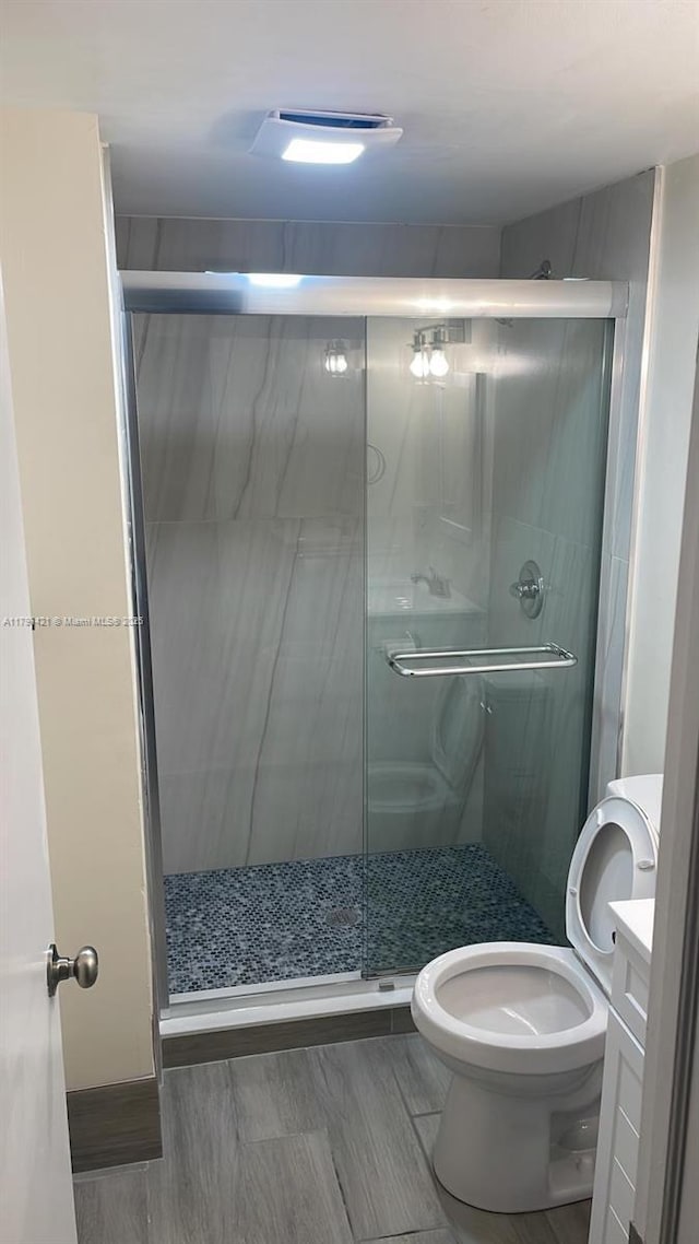 9851 Sandalfoot Blvd Unit 208, Boca Raton, FL 33428 - bathroom with vanity, toilet, and a stall shower