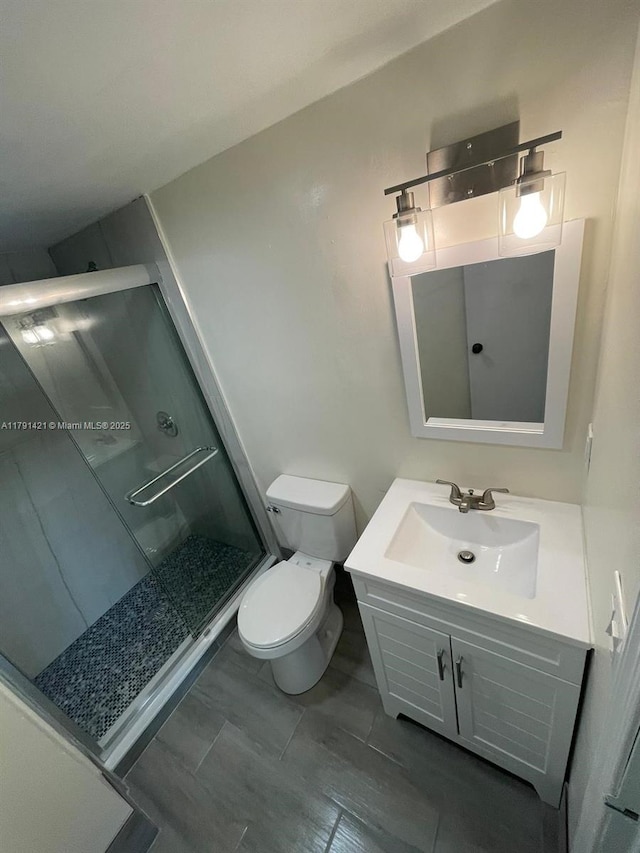9851 Sandalfoot Blvd Unit 208, Boca Raton, FL 33428 - full bathroom featuring a shower stall, vanity, and toilet
