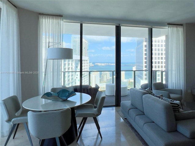68 SE 6th St Unit 3611, Miami, FL 33131 - dining space with light floors, a water view, and a wealth of natural light