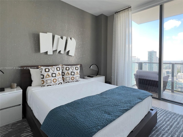 68 SE 6th St Unit 3611, Miami, FL 33131 - bedroom featuring floor to ceiling windows and access to exterior