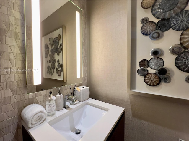 68 SE 6th St Unit 3611, Miami, FL 33131 - bathroom with backsplash and vanity